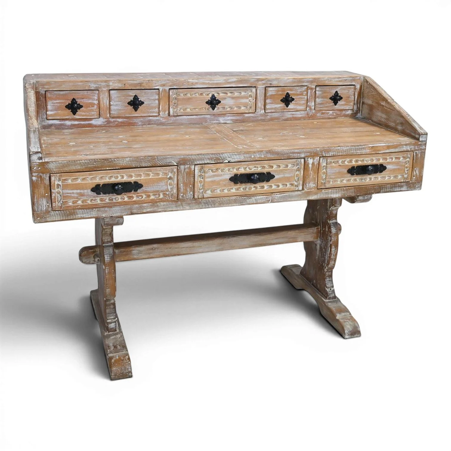 Handmade Mexican Las Carreras white washed desk with hand-carved details, iron hardware, and eight drawers