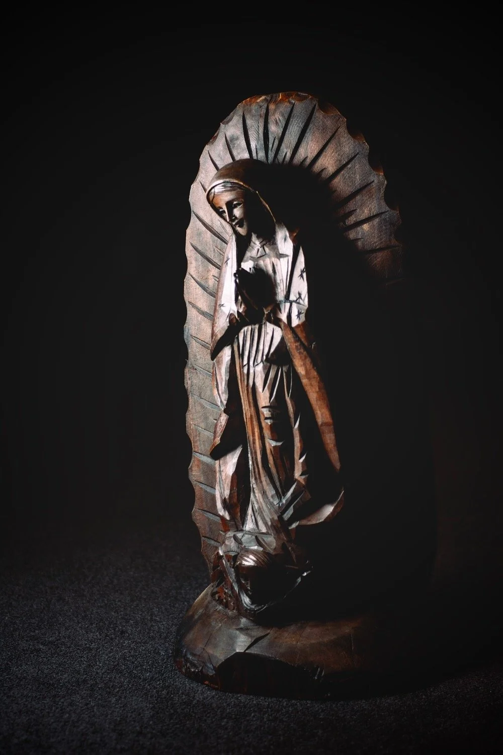 Each Virgen María Tallada is one-of-a-kind, its flowing details and rich finish handcrafted by skilled artisans in Mexico.
