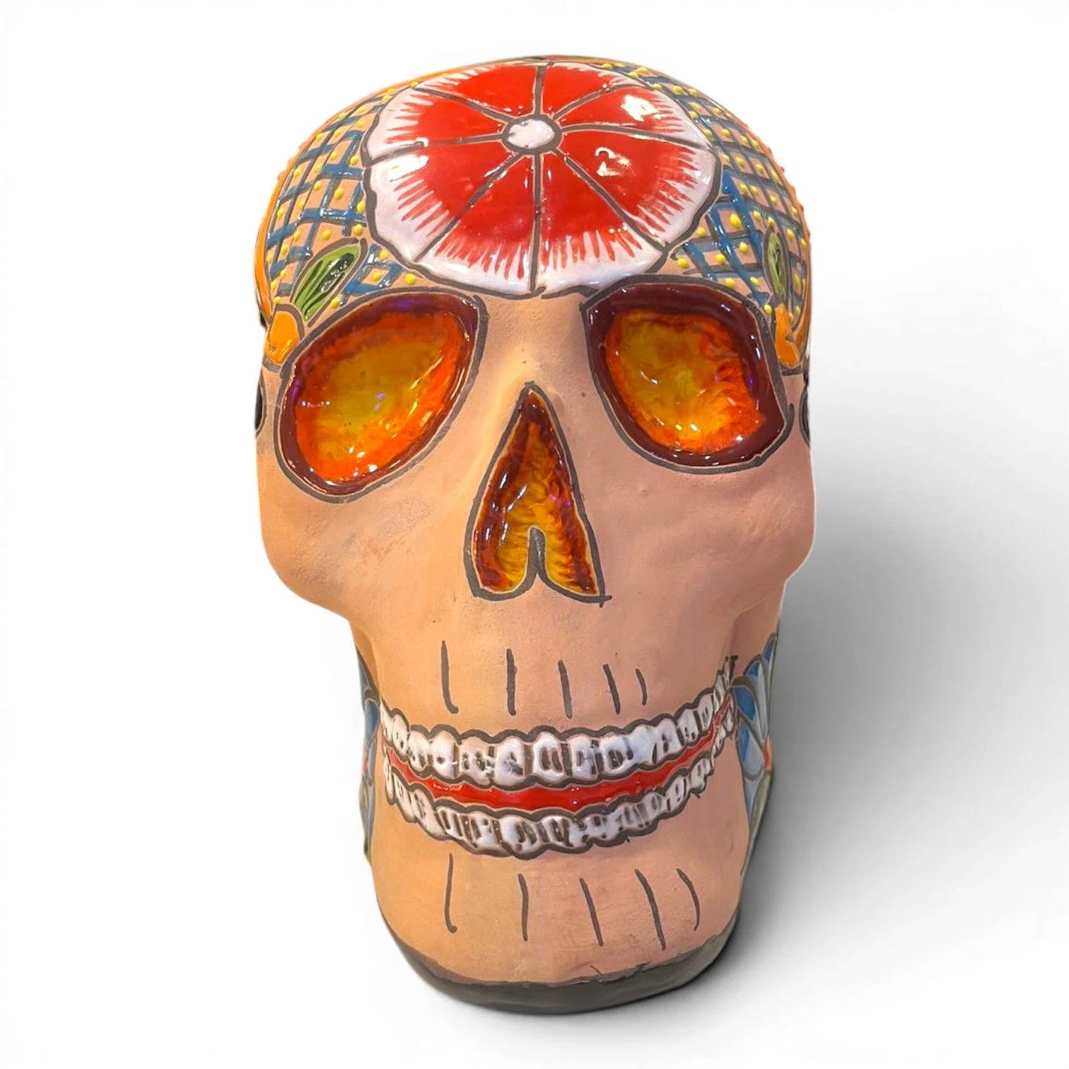 Handmade Mexican Talavera painted clay skull with vibrant artisan design