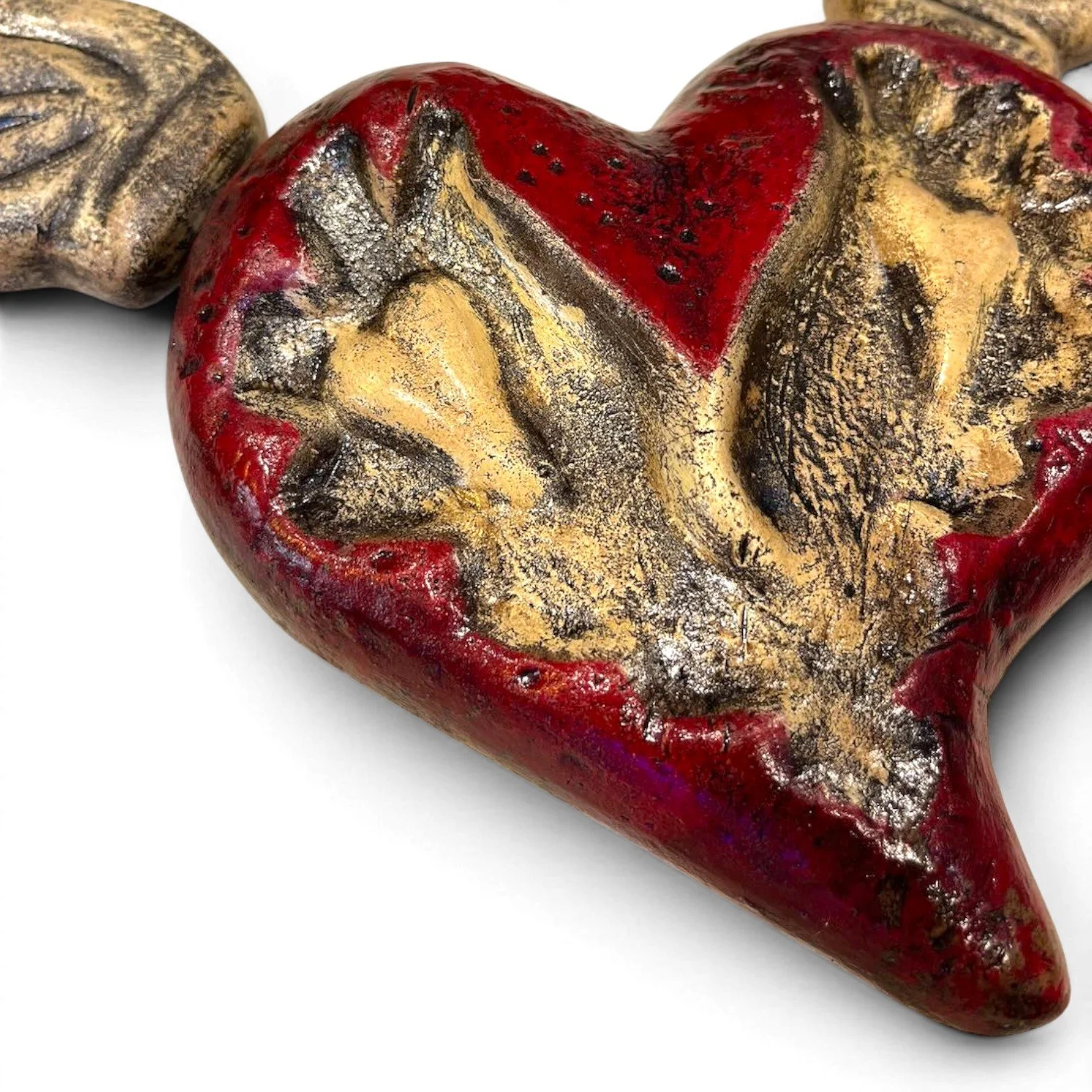 Handmade Mexican Sagrado Corazón con Alas clay wall art featuring a distressed red sacred heart with sculpted wings.