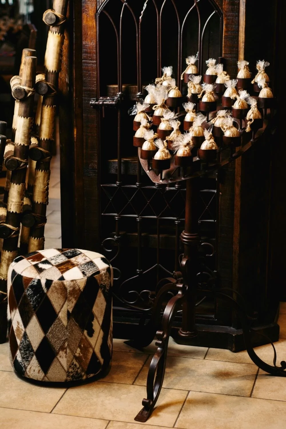 Gorgeous heart shaped candelabra, iron door armoire and diamond cowhide ottoman - Milagros Rústicos