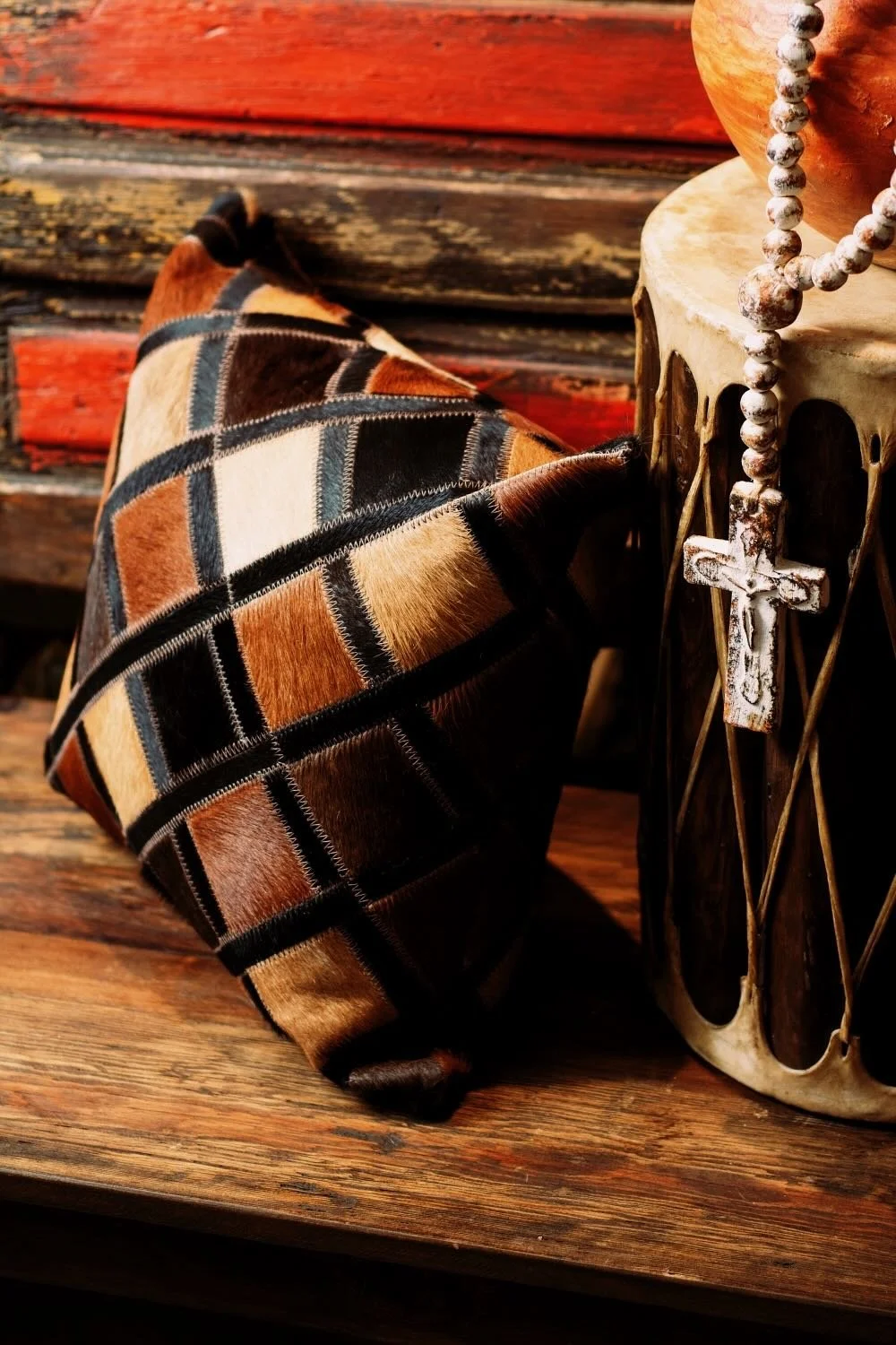 Shop a handmade cowhide and leather pillow from Brazil. Rustic luxury accent pillow with unique patterns for sofas, chairs, and home decor.