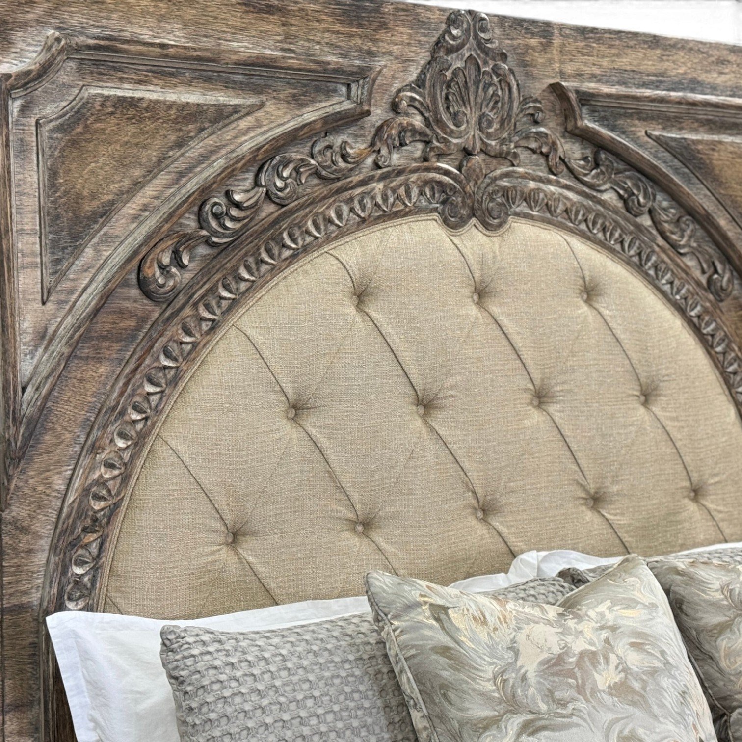 Handmade whitewashed king bed with button-tufted upholstered headboard