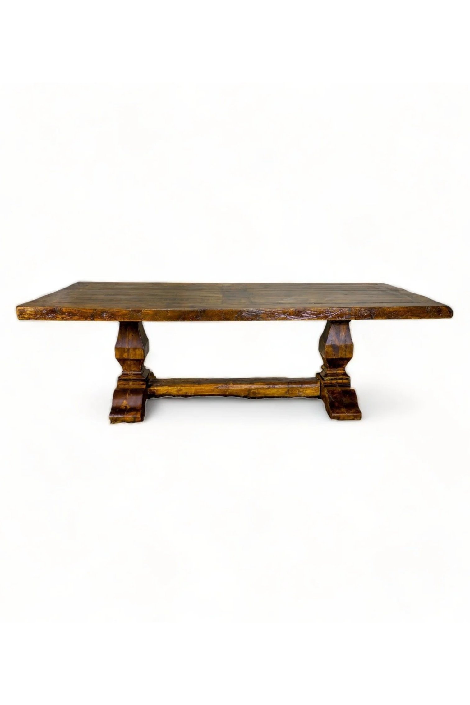 Shop a handmade reclaimed wood dining table from Mexico. Hacienda-style rustic furniture with trestle base, perfect for warm, elegant dining spaces.