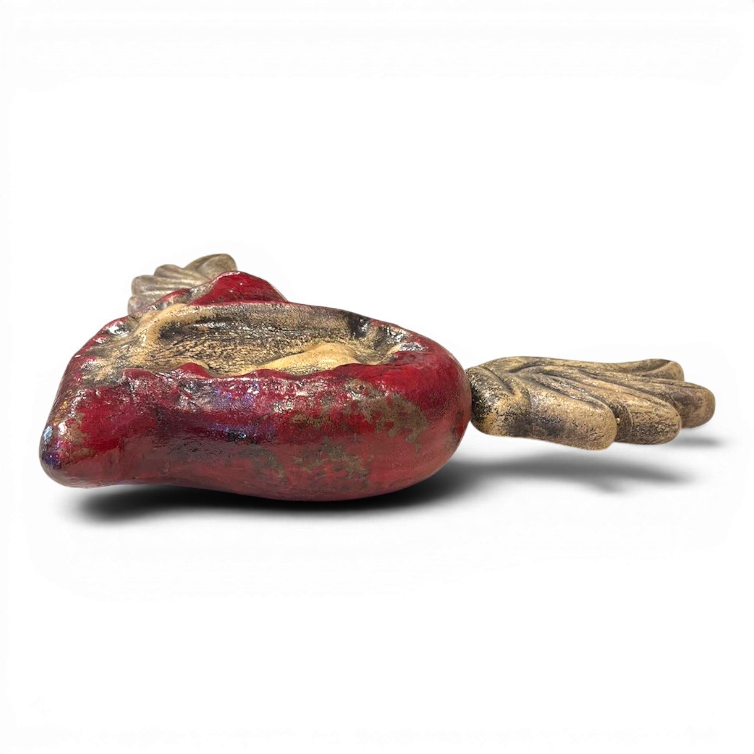 Handmade Mexican Sagrado Corazón con Alas clay wall art featuring a distressed red sacred heart with sculpted wings.