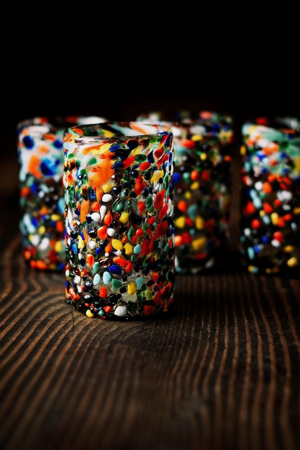 Shop a handblown Guanajuato short glass from Mexico. Colorful confetti design artisan drinkware perfect for everyday use and entertaining.