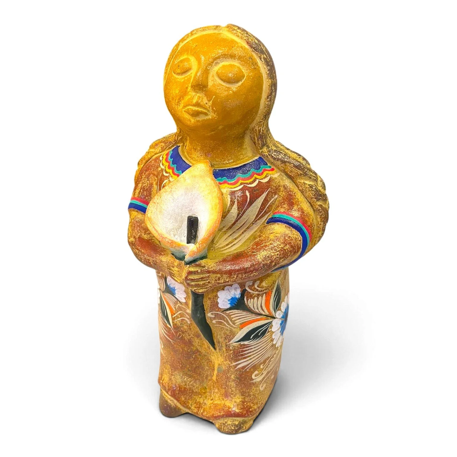 Handmade Mexican clay figure of a woman holding a calla lily