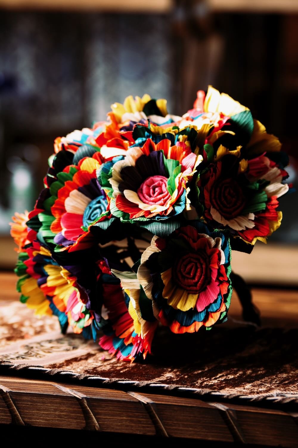 Multicolor Cornhusk Flower Bundle. Set of 12 vibrant, handmade cornhusk flowers from Mexico. Features flexible 12" metal stems and 4" flower bulbs.