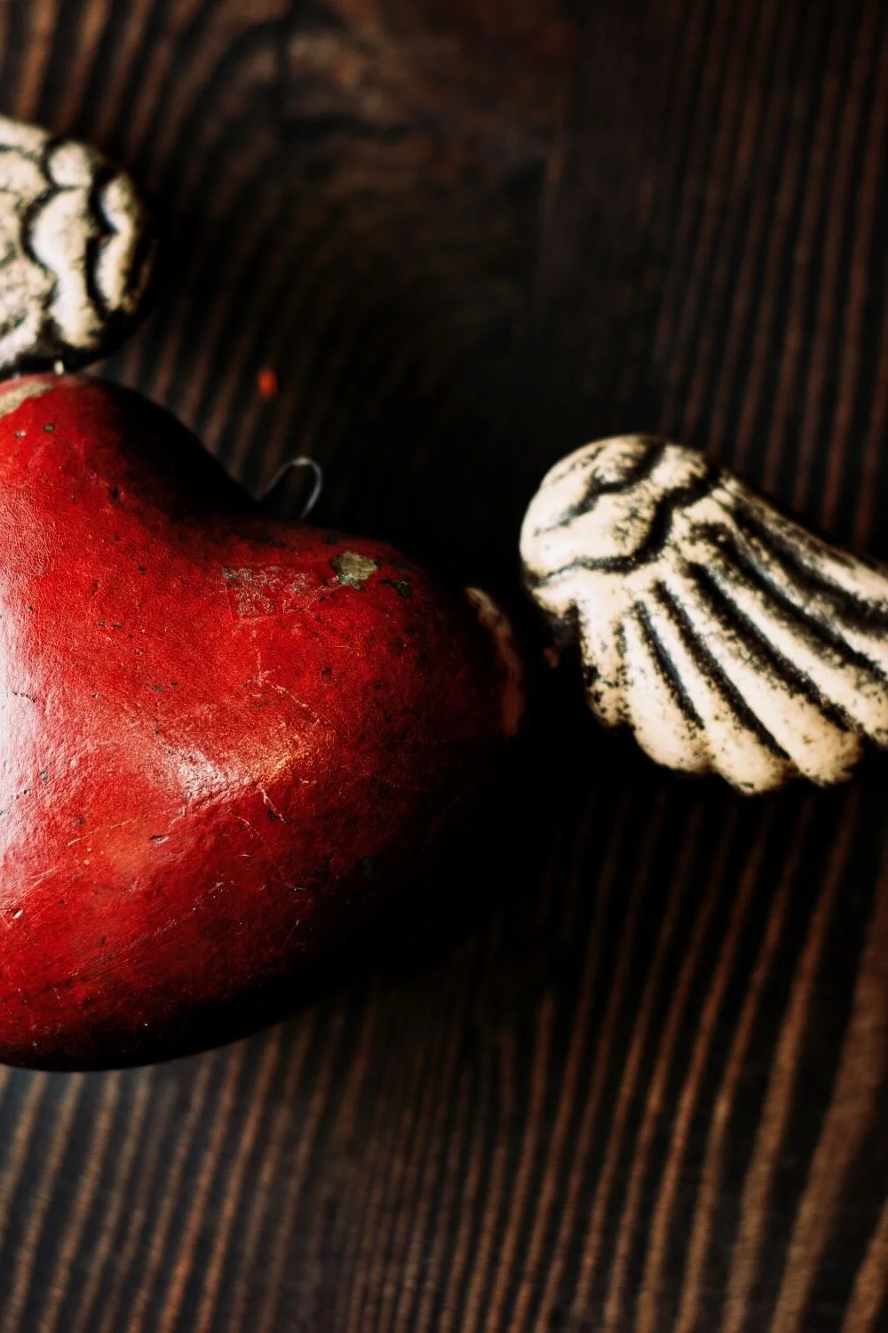 Shop a handmade sacred heart with wings from Mexico. Unique clay decor with spiritual symbolism and artisan craftsmanship for home accents.