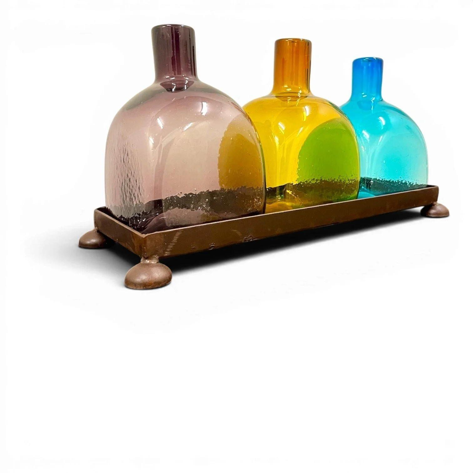 Handmade Mexican serving set featuring three handblown glass bottles and a handcrafted iron tray, perfect for entertaining and rustic décor.