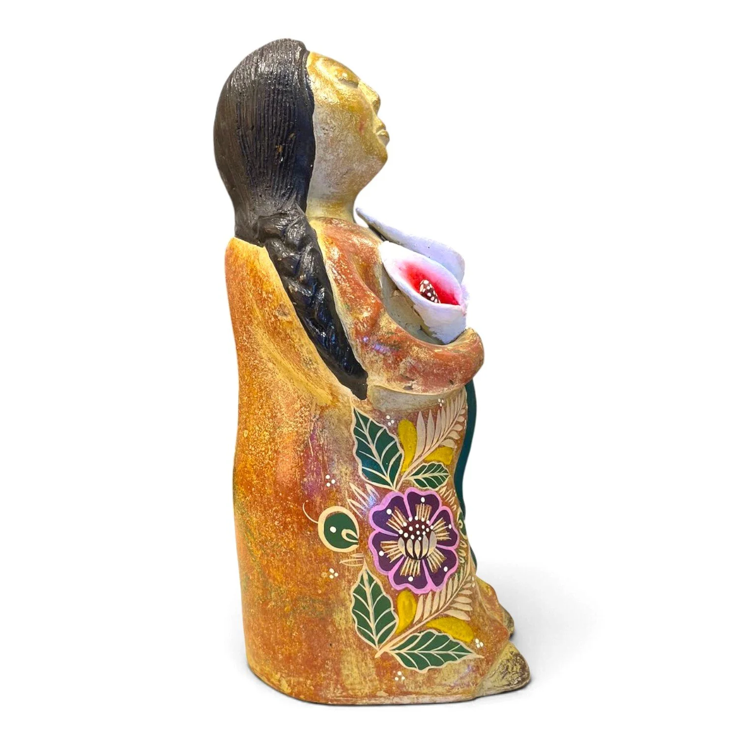 Handmade Mexican clay figure of a woman holding three calla lilies
