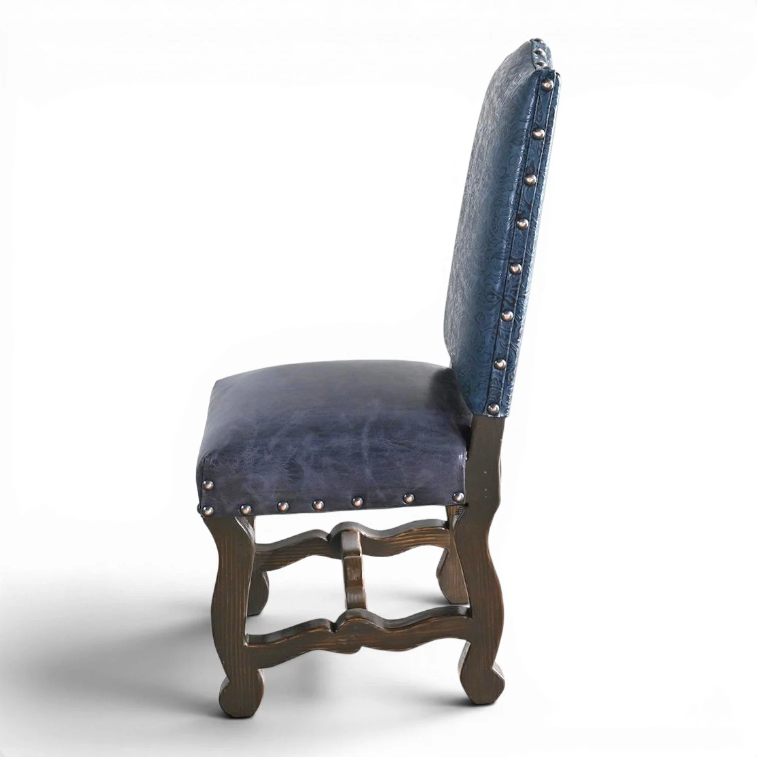 Handmade San Lucas cobalt blue leather dining chair with embossed leather back, nailhead trim, and dark wood frame crafted in Mexico.