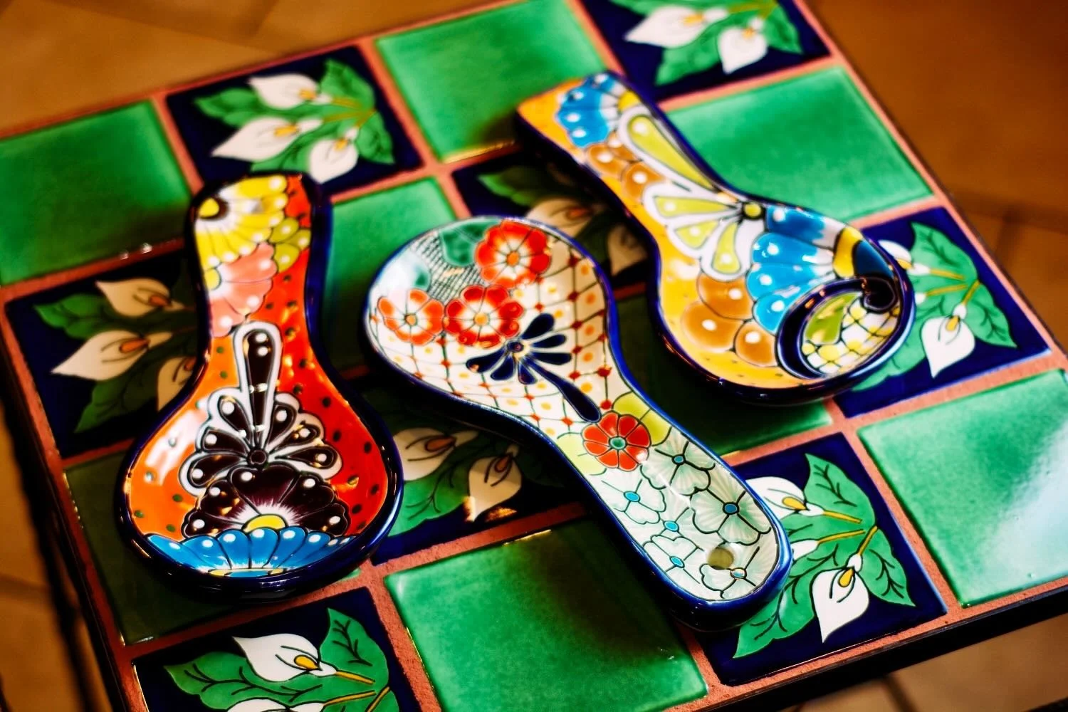Talavera tile tables and Talavera spoon rests from Mexico.