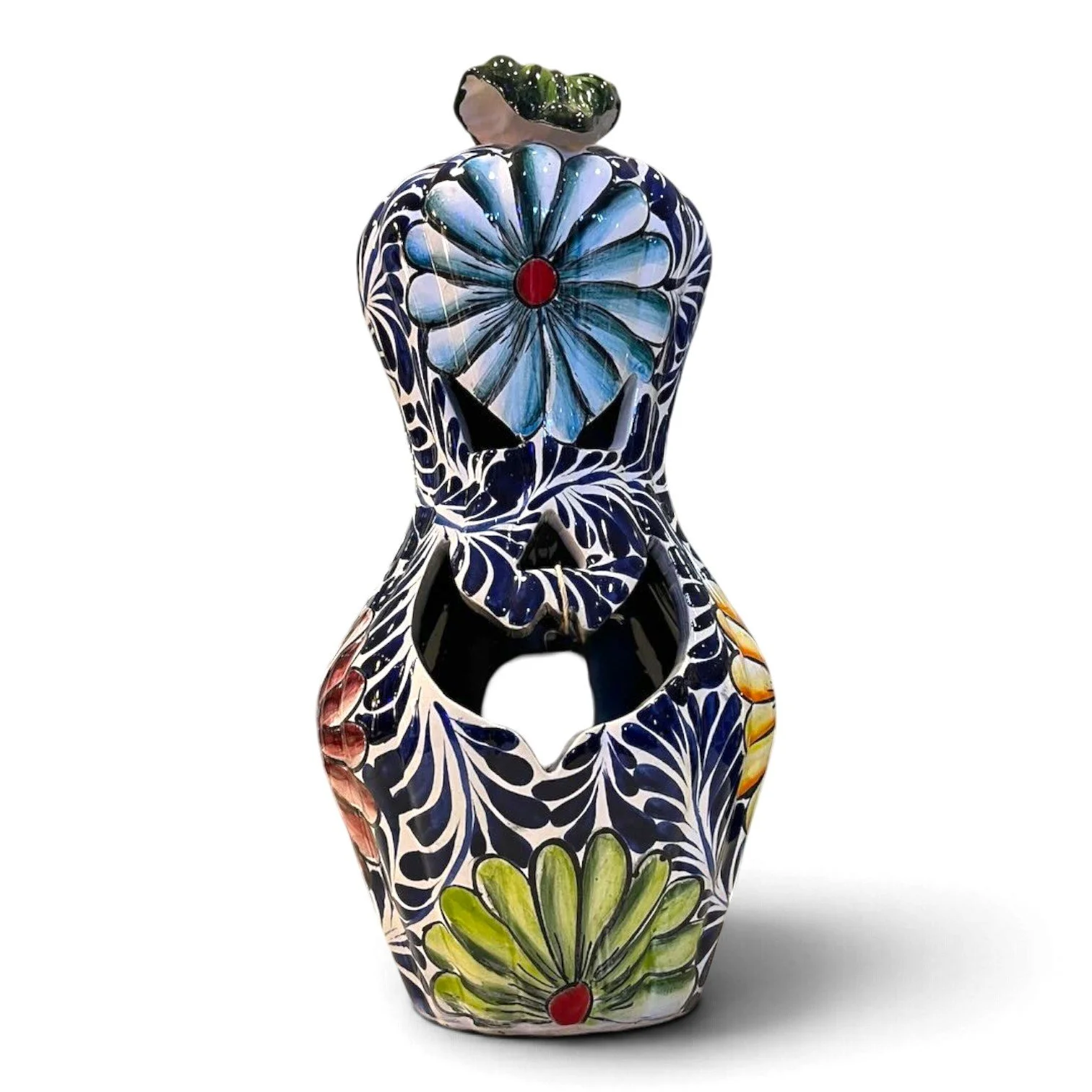 Handmade Talavera jack-o'-lantern gourd with hand-painted design and cutout for candlelight