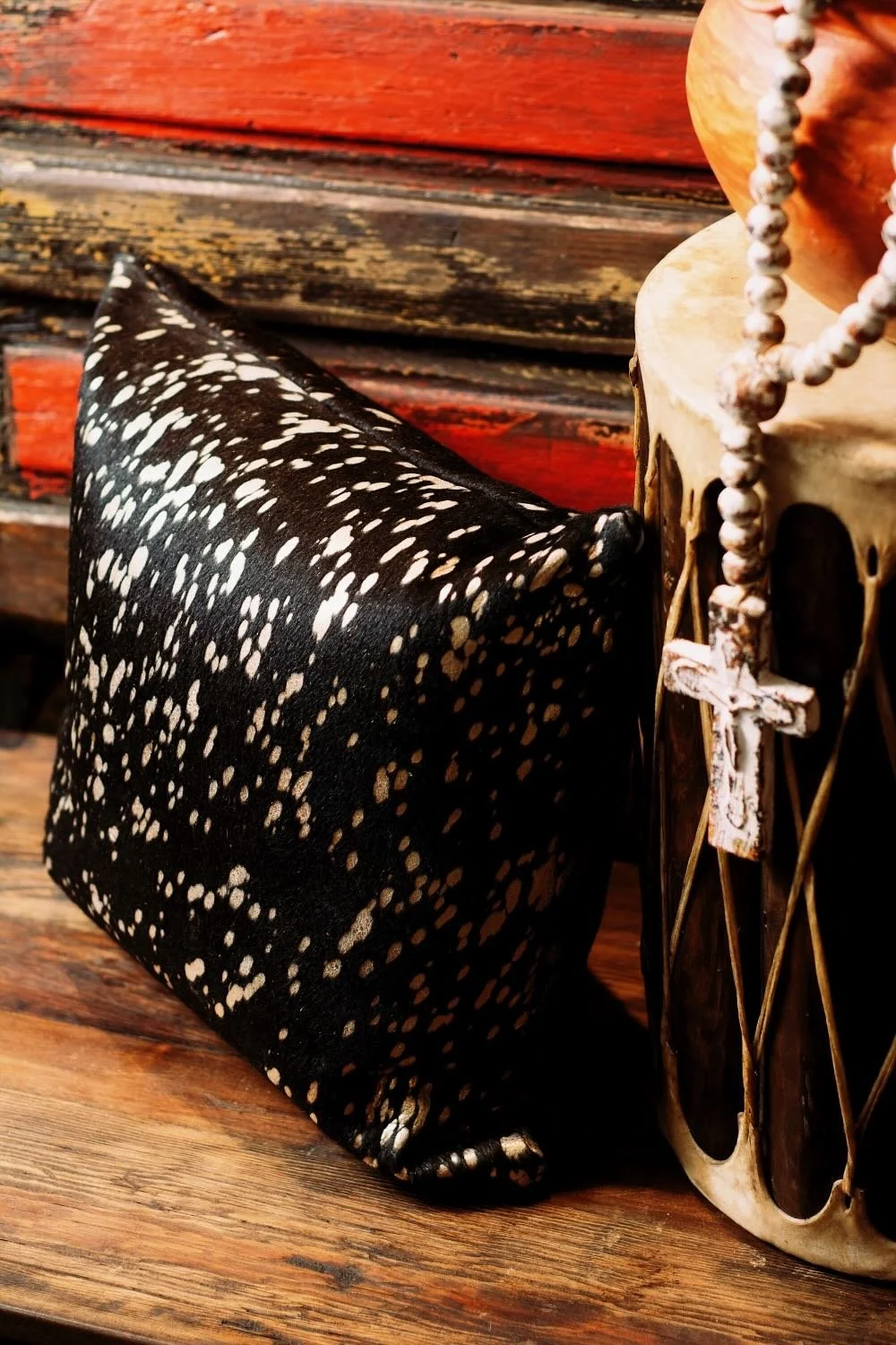 Shop a handmade cowhide and leather pillow from Brazil. Rustic luxury accent pillow with unique patterns for sofas, chairs, and home decor.
