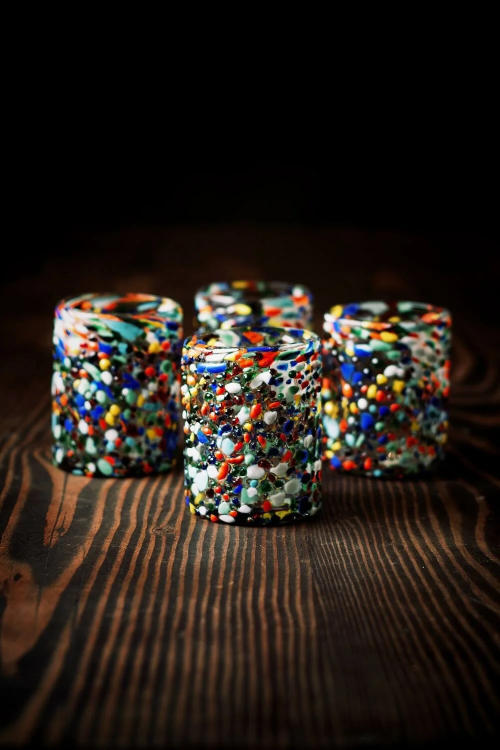 Shop a handblown Guanajuato tumbler from Mexico. Colorful confetti glassware perfect for everyday drinks, entertaining, and unique table settings.