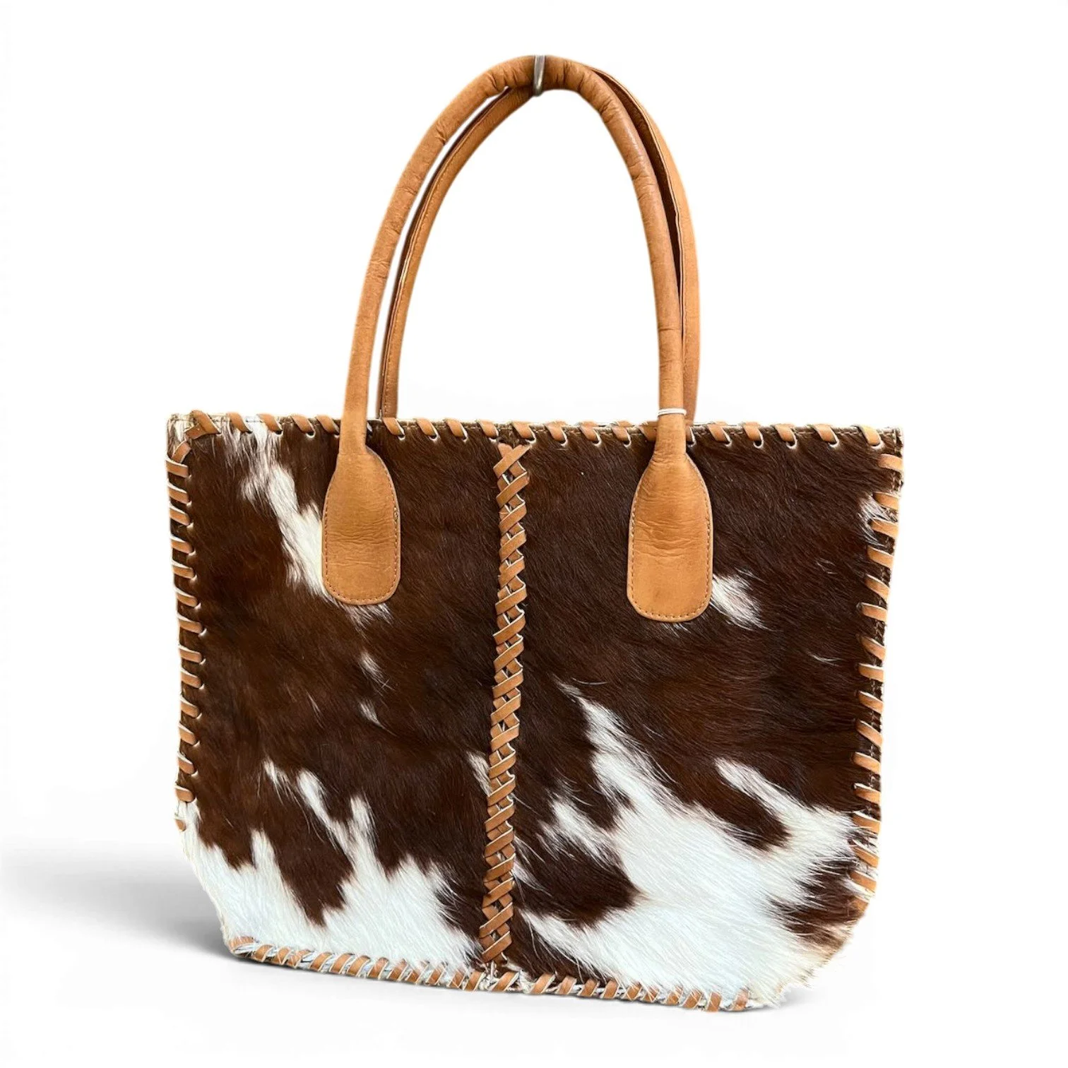 Handmade Brazilian Cheyenne cowhide tote bag with leather handles and detailed stitching