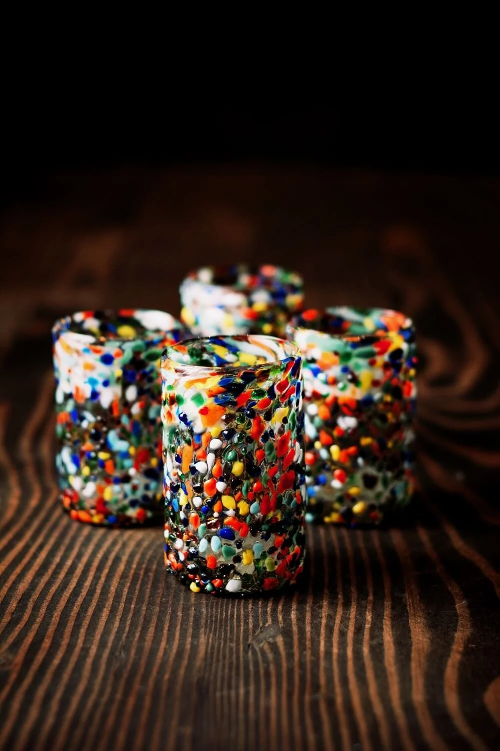 Shop a handblown Guanajuato short glass from Mexico. Colorful confetti design artisan drinkware perfect for everyday use and entertaining.