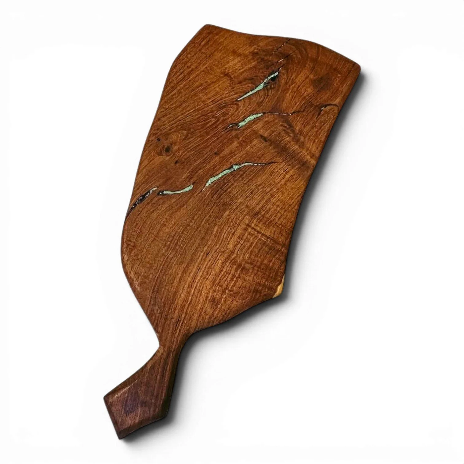 Handmade Mexican mesquite wood cutting board with turquoise inlay and natural wood grain.