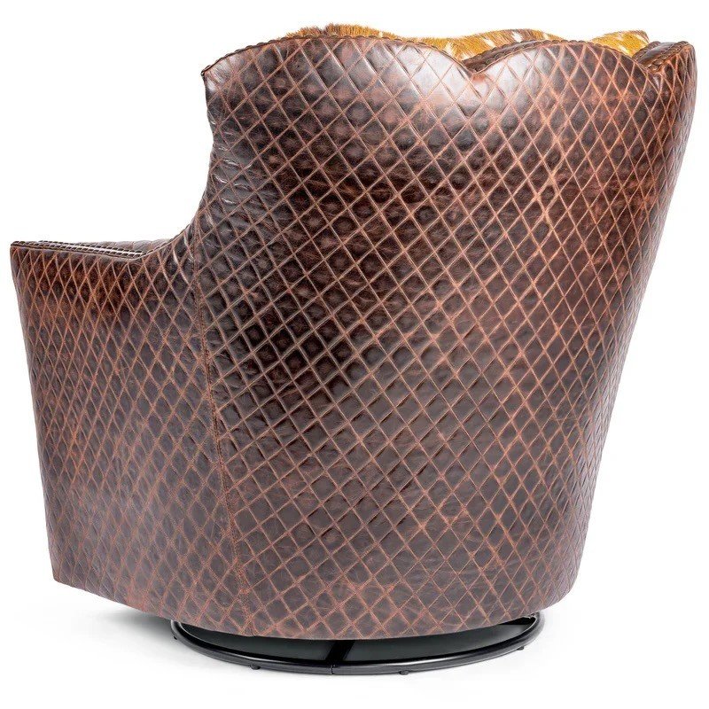 The Cody Axis Hide Swivel Chair features genuine axis deer hide, artisan leather accents, and handcrafted Western design for a truly unique luxury statement piece.