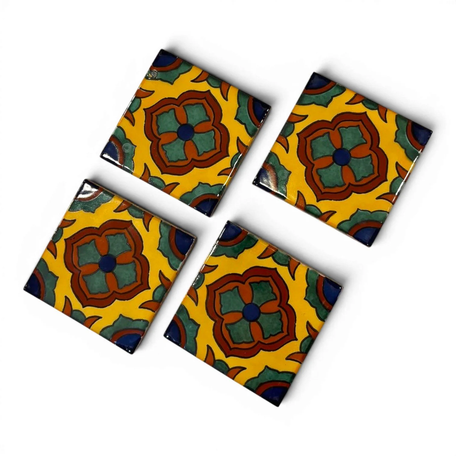 Set of four colorful Talavera tile coasters with hand-painted Mexican pottery designs