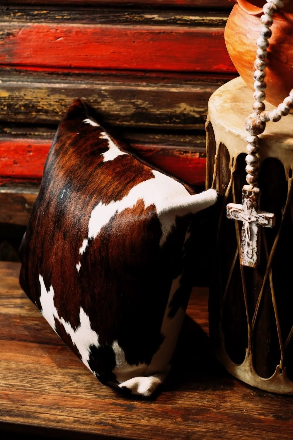 Shop a handmade cowhide and leather pillow from Brazil. Rustic luxury accent pillow with unique patterns for sofas, chairs, and home decor.