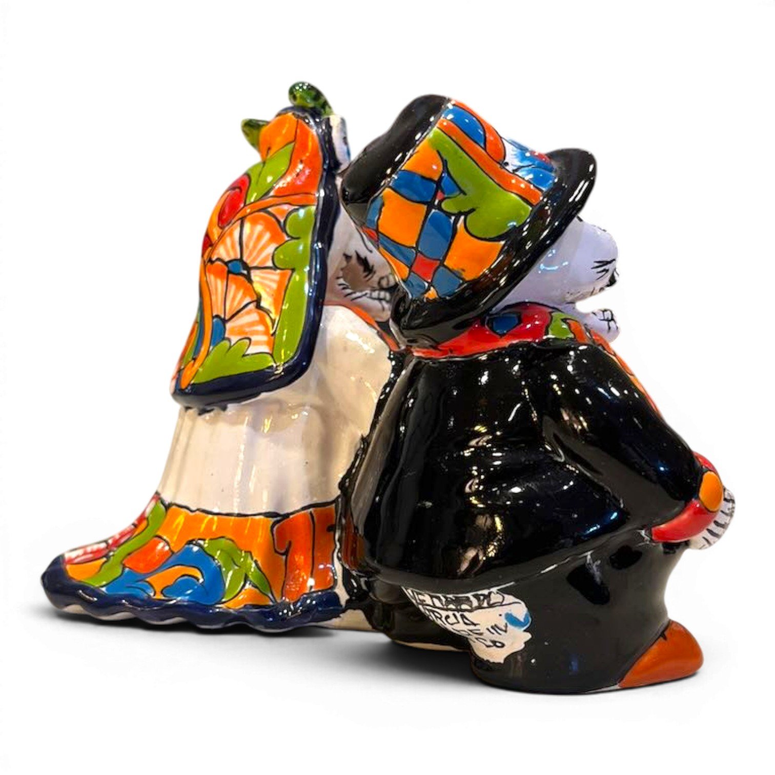 Handmade Talavera figure of an elderly catrín and catrina couple, vibrant hand-painted colors