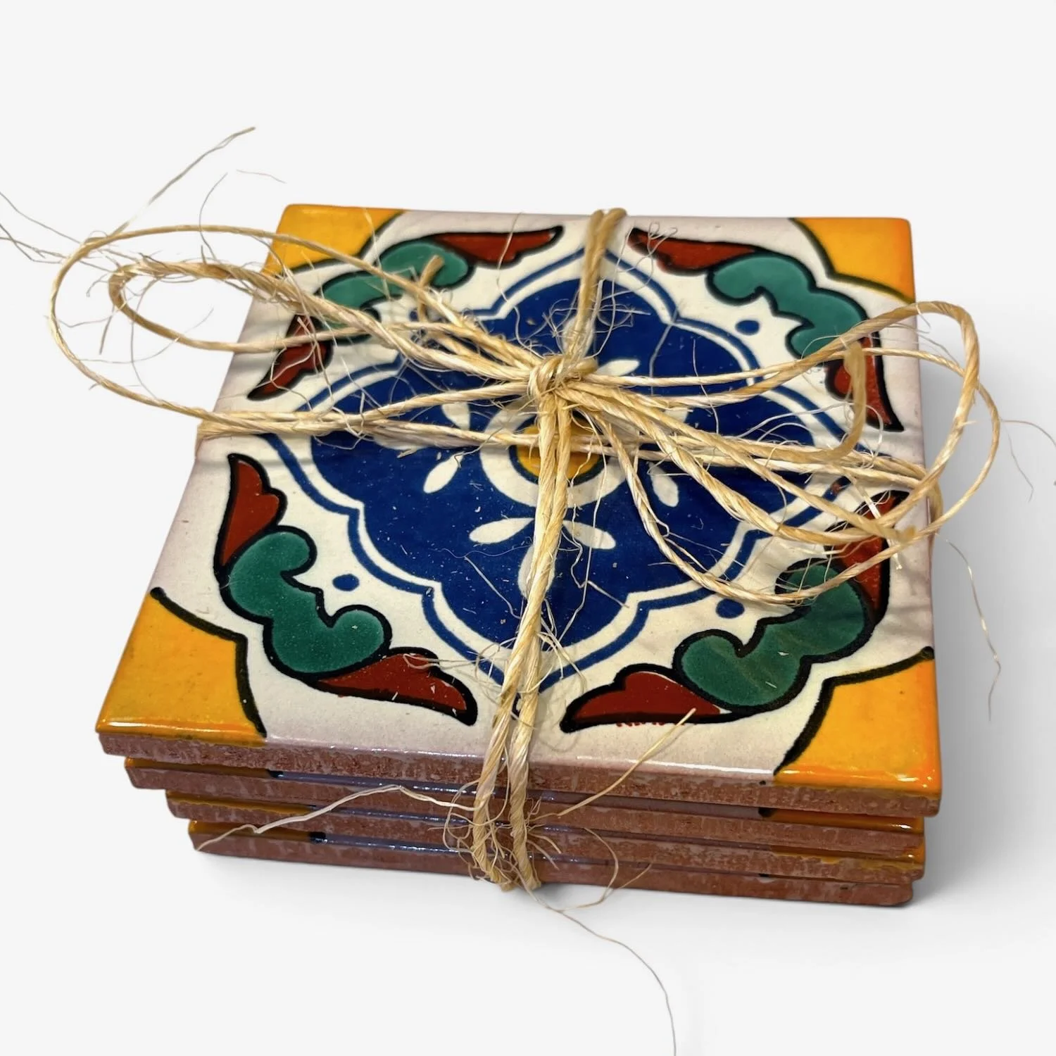 Handmade Talavera tile coaster set from Mexico featuring four colorful ceramic coasters with protective rubber bumpers.