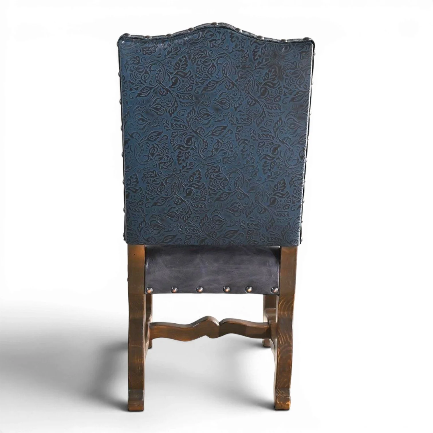 Handmade San Lucas cobalt blue leather dining chair with embossed leather back, nailhead trim, and dark wood frame crafted in Mexico.