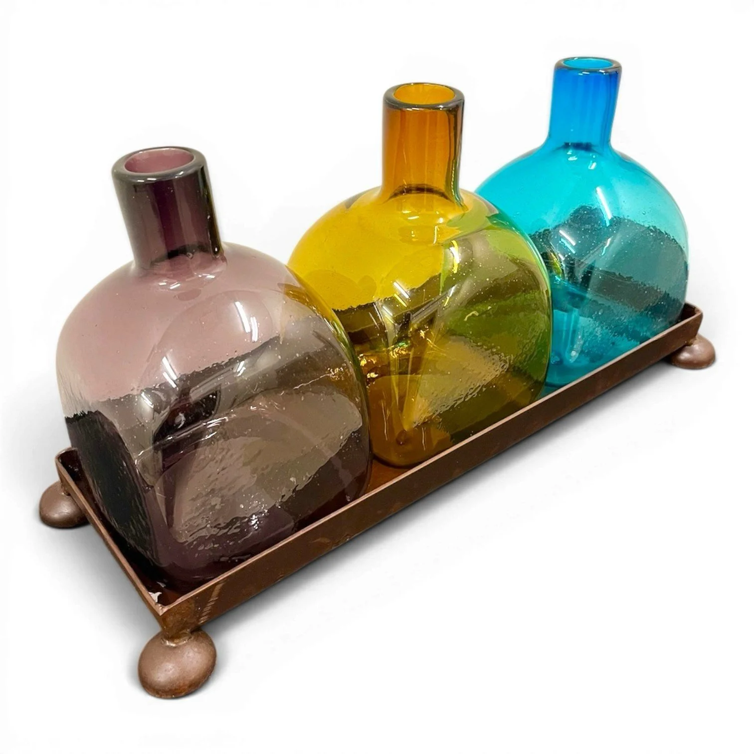 Handmade Mexican serving set featuring three handblown glass bottles and a handcrafted iron tray, perfect for entertaining and rustic décor.
