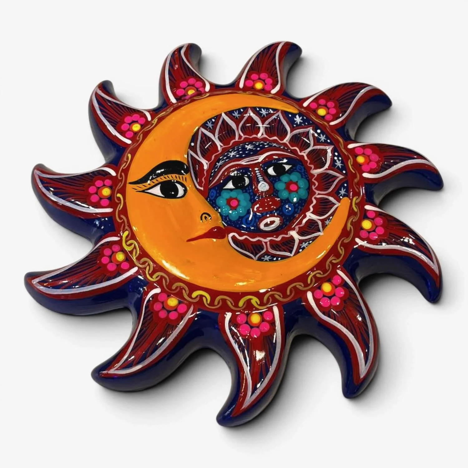 Handmade Mexican Talavera clay sun and moon wall art with vibrant hand-painted floral patterns.
