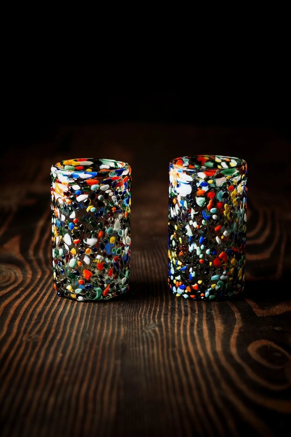 Shop a handblown Guanajuato tall tumbler from Mexico. Colorful confetti glassware perfect for everyday drinks, entertaining, and unique table settings.