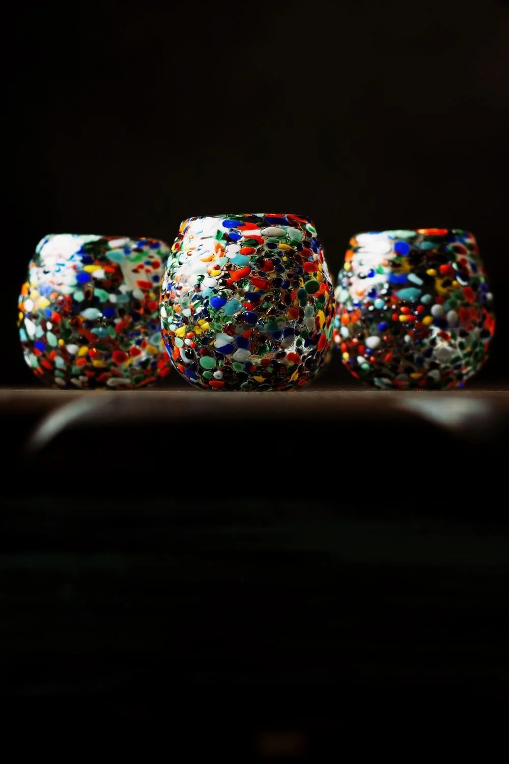 Shop a handblown Guanajuato glass from Mexico. Colorful confetti design artisan drinkware perfect for everyday use or entertaining.