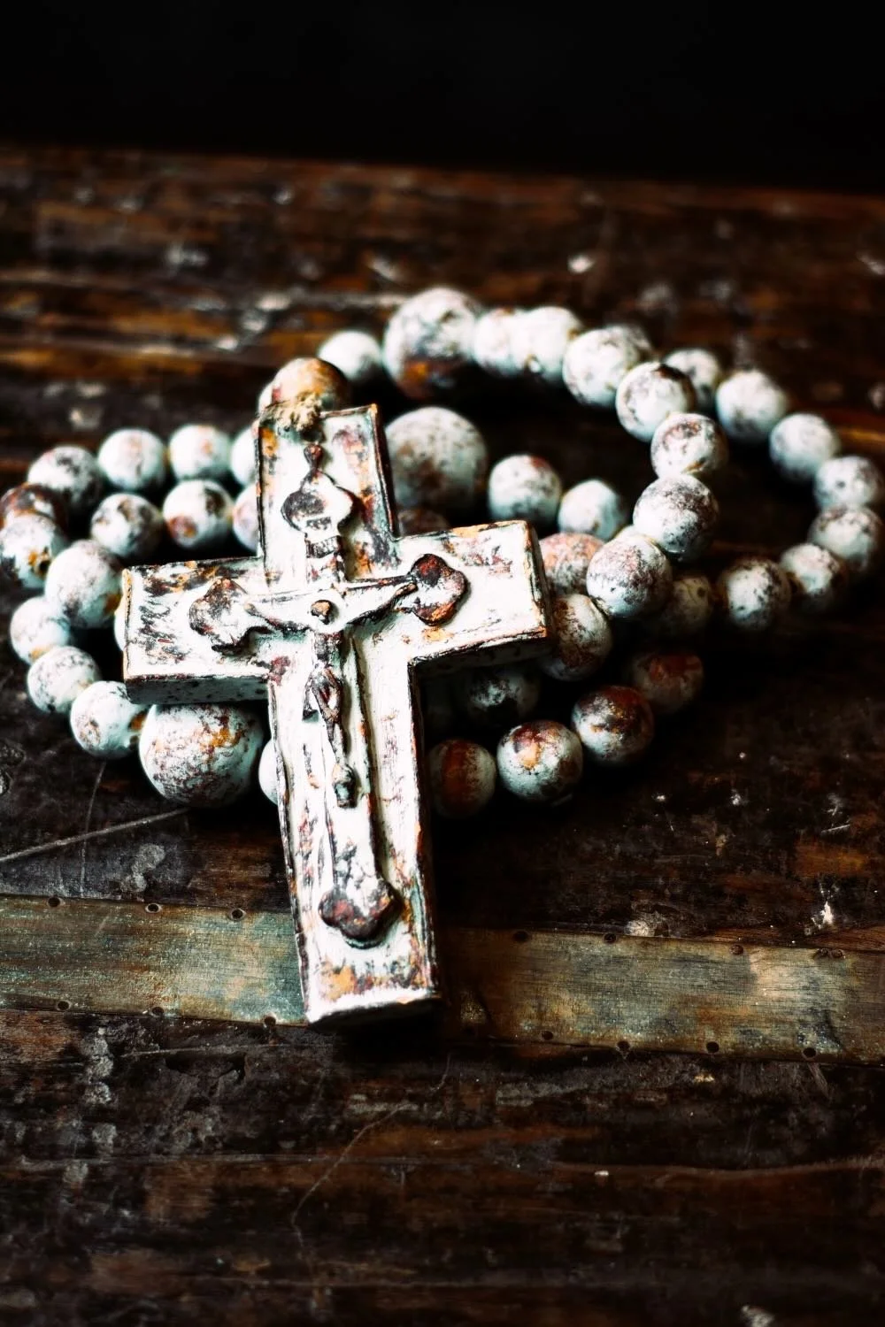 Rosario de Barro - Turquoise. Oversized 45" turquoise clay rosary from Milagros Rústicos. Handcrafted in Mexico with a distressed finish. Ideal for large-scale decor.