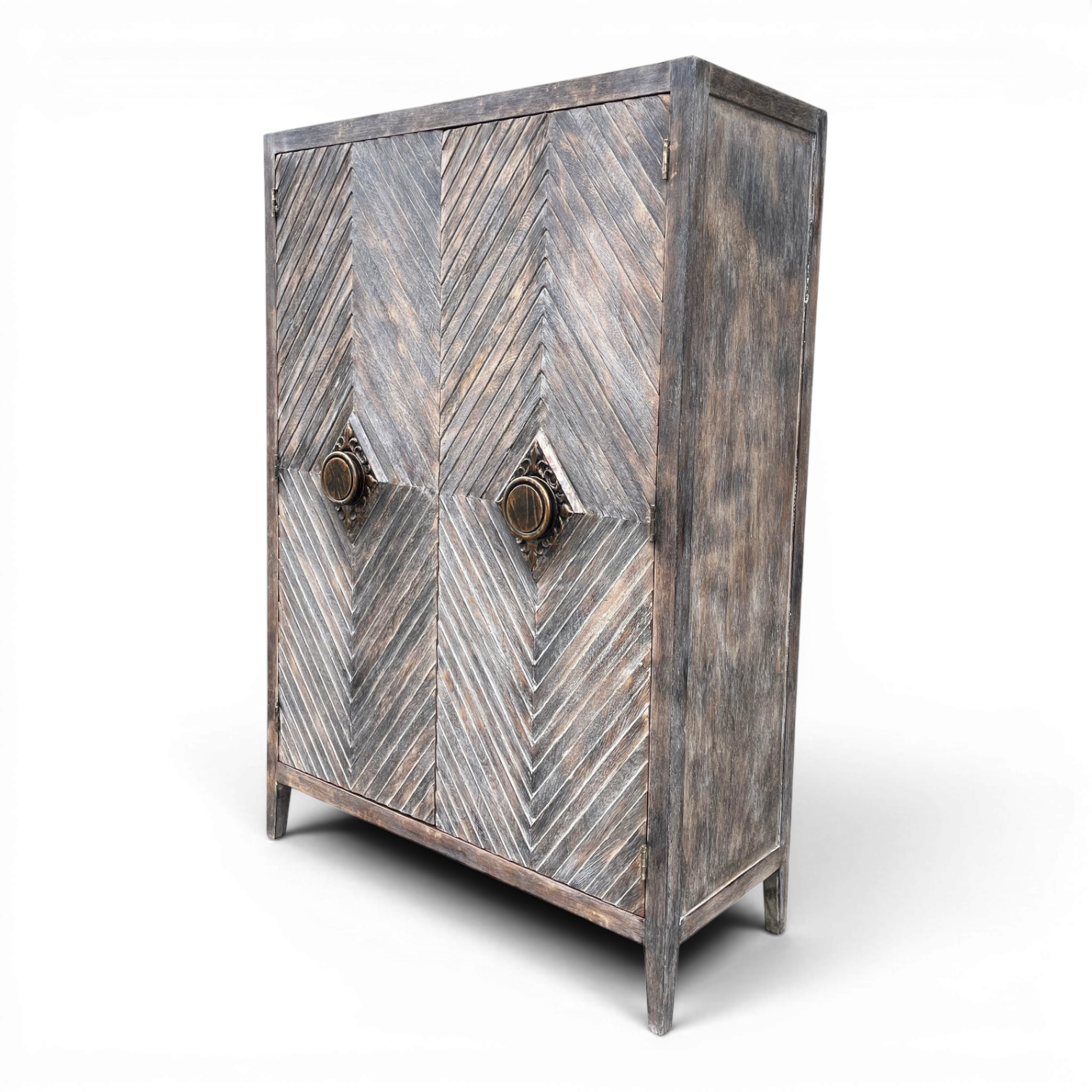 Matucana handmade Peruvian solid wood armoire with chevron-pattern doors, decorative brass handles, and rustic design.