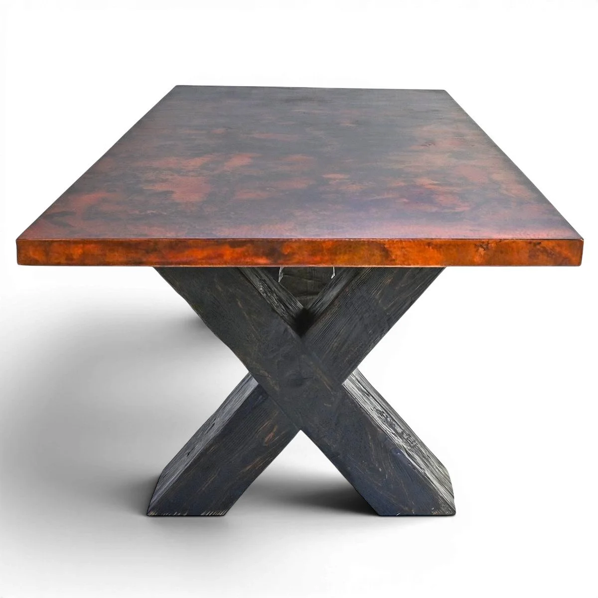 Artesia Copper Dining Table handcrafted in Mexico with hand-hammered dark copper top and solid wood X-shaped base.