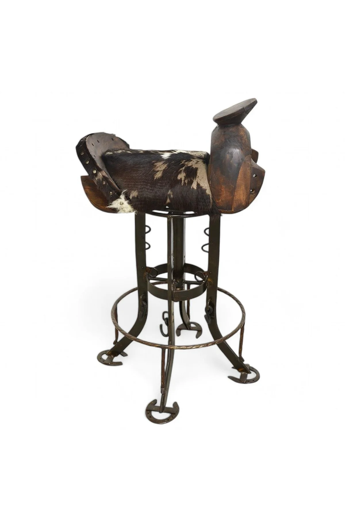 Shop a handmade cowhide saddle barstool from Mexico. Western-style seating with swivel base, carved wood, and unique artisan detail.