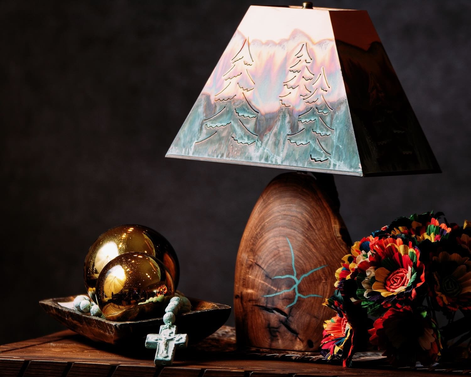 Mezquite y Cobre Table Lamp - Copper Pine Tree Shade. Artisan table lamp featuring a sculpted mesquite base with turquoise inlay and a green washed copper pine tree shade.