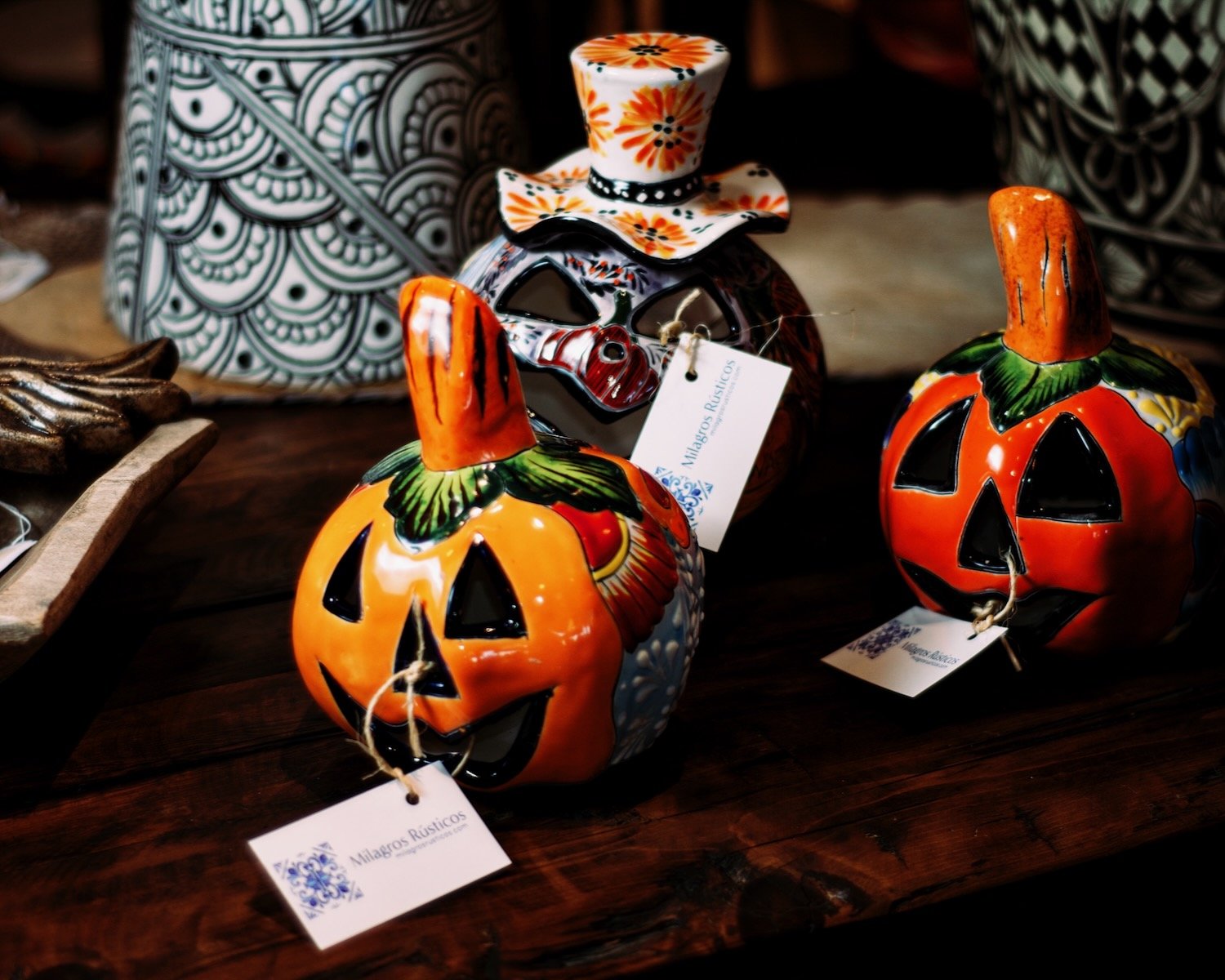 Three small Jack O' Lanterns for the Halloween season. Visit Milagros Rústicos in Arizona.