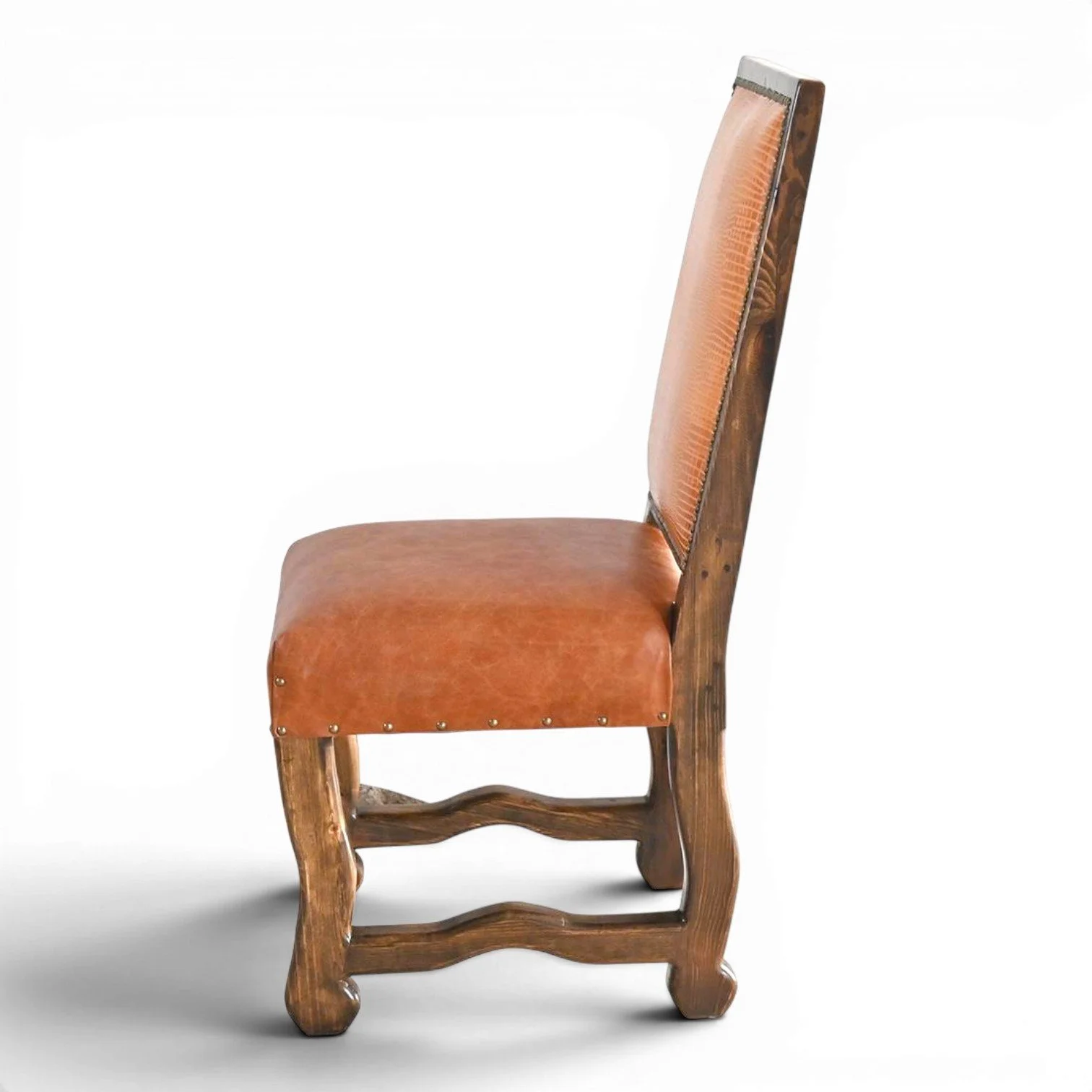 Handmade San Lucas terracotta leather dining chair with embossed leather back, nailhead trim, and dark wood frame crafted in Mexico.