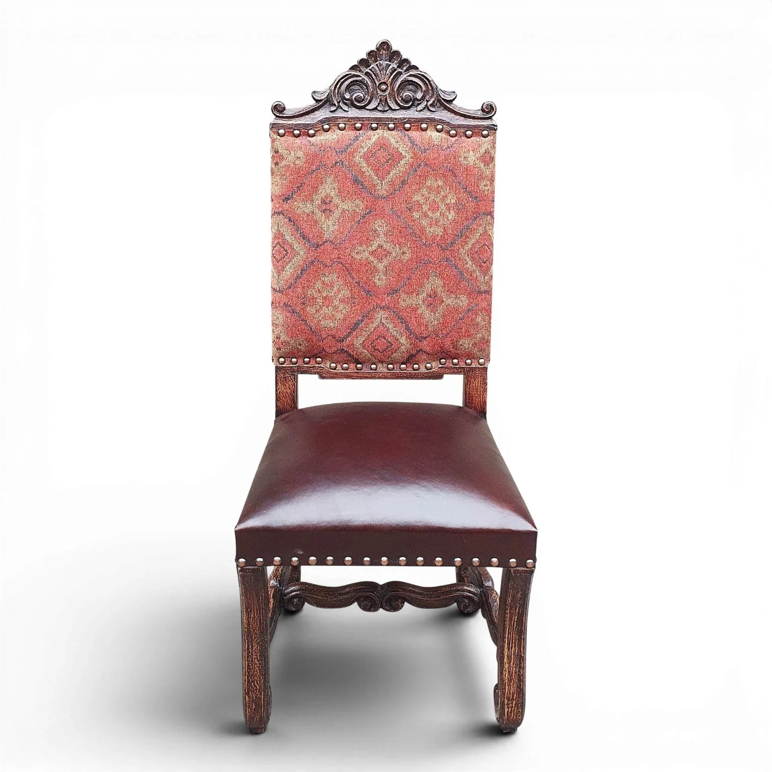Handmade dining chair with carved wood frame, fabric backrest, and leather seat