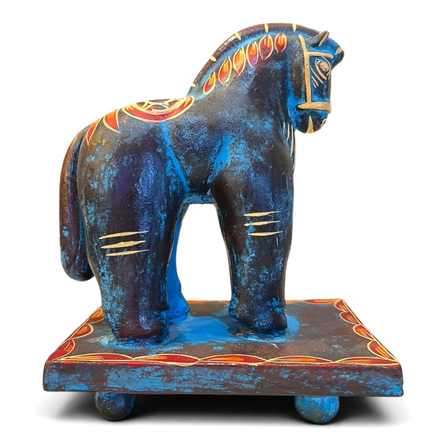 Handmade clay Trojan horse figure with unique hand-painted design on a pedestal