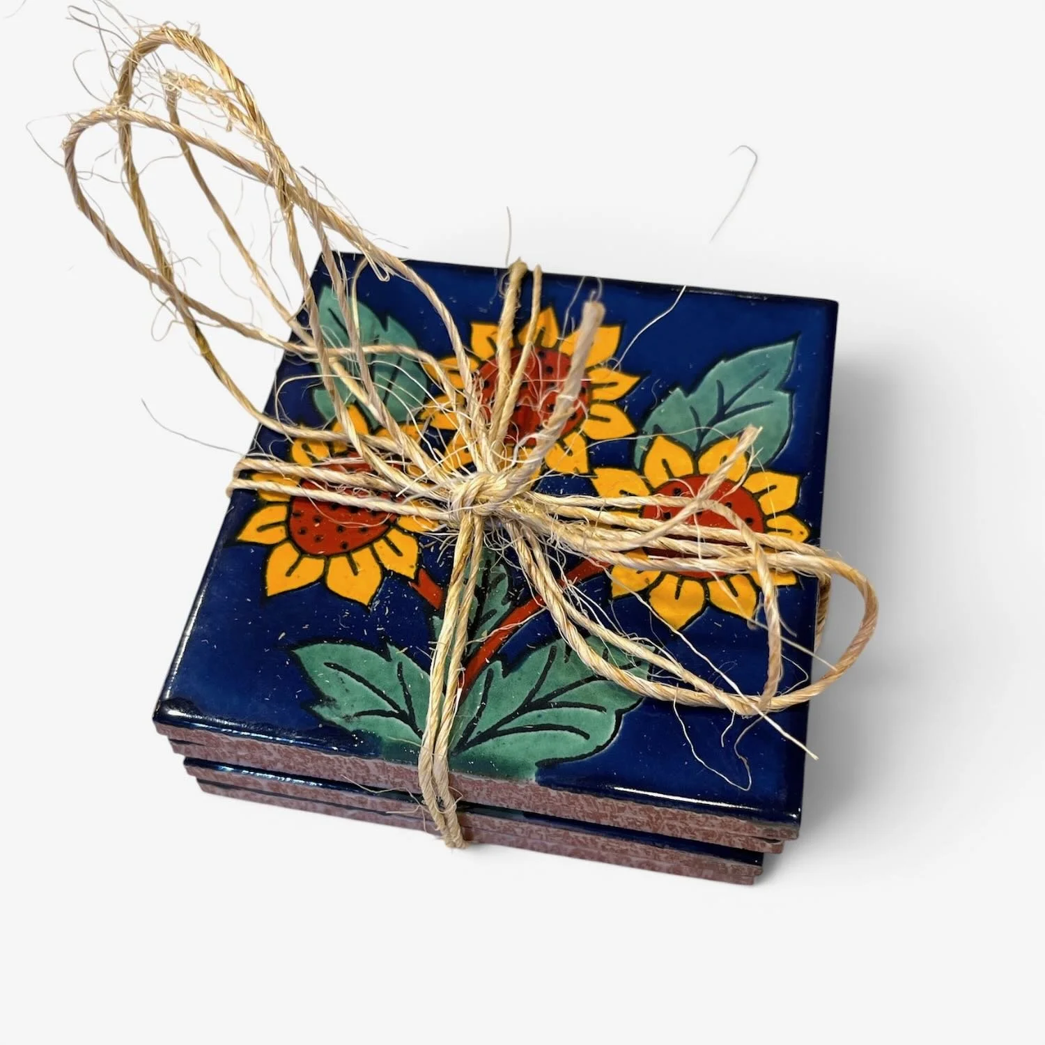 Handmade Talavera tile coaster set from Mexico featuring four colorful ceramic coasters with protective rubber bumpers.
