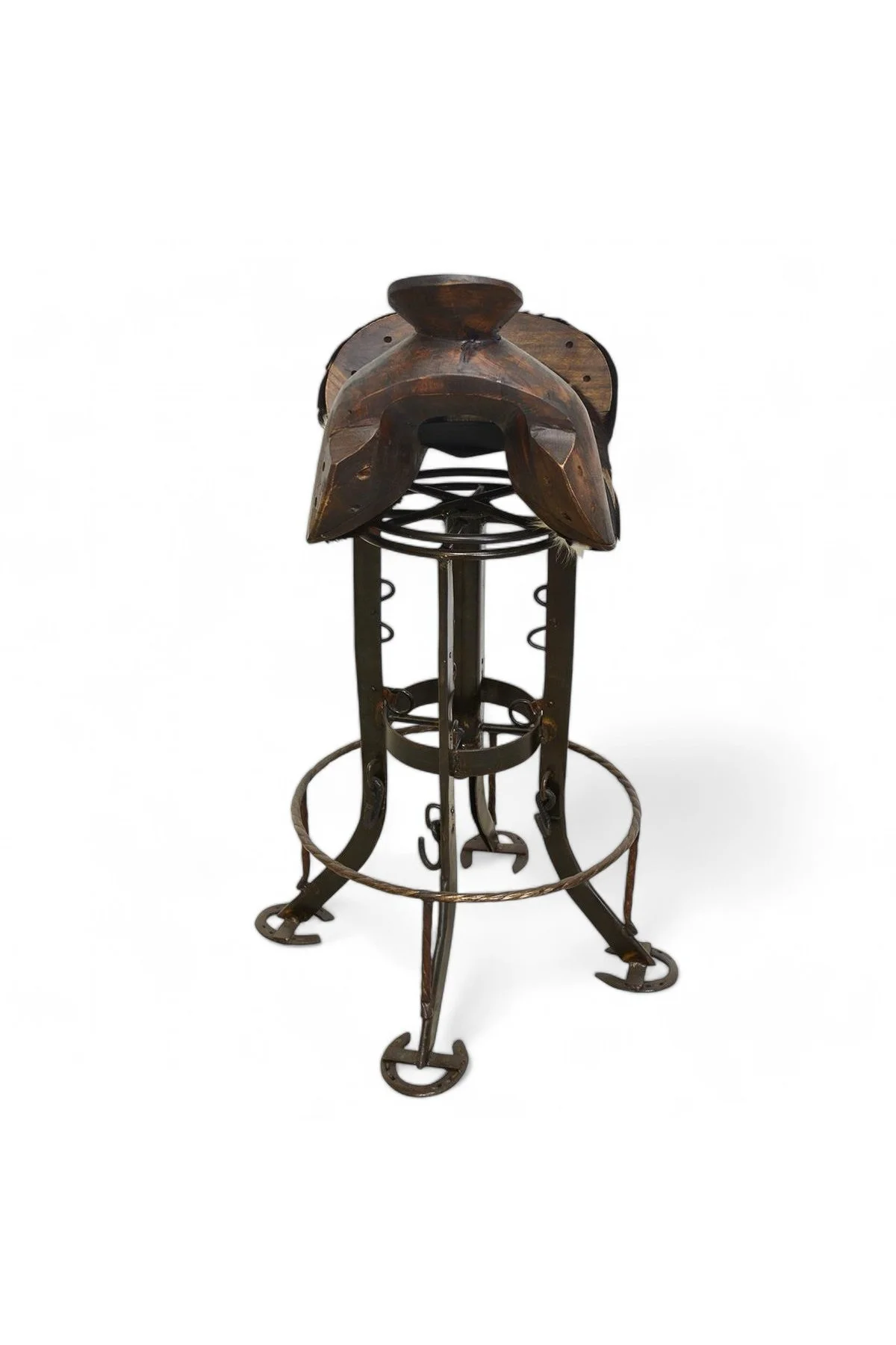Shop a handmade cowhide saddle barstool from Mexico. Western-style seating with swivel base, carved wood, and unique artisan detail.