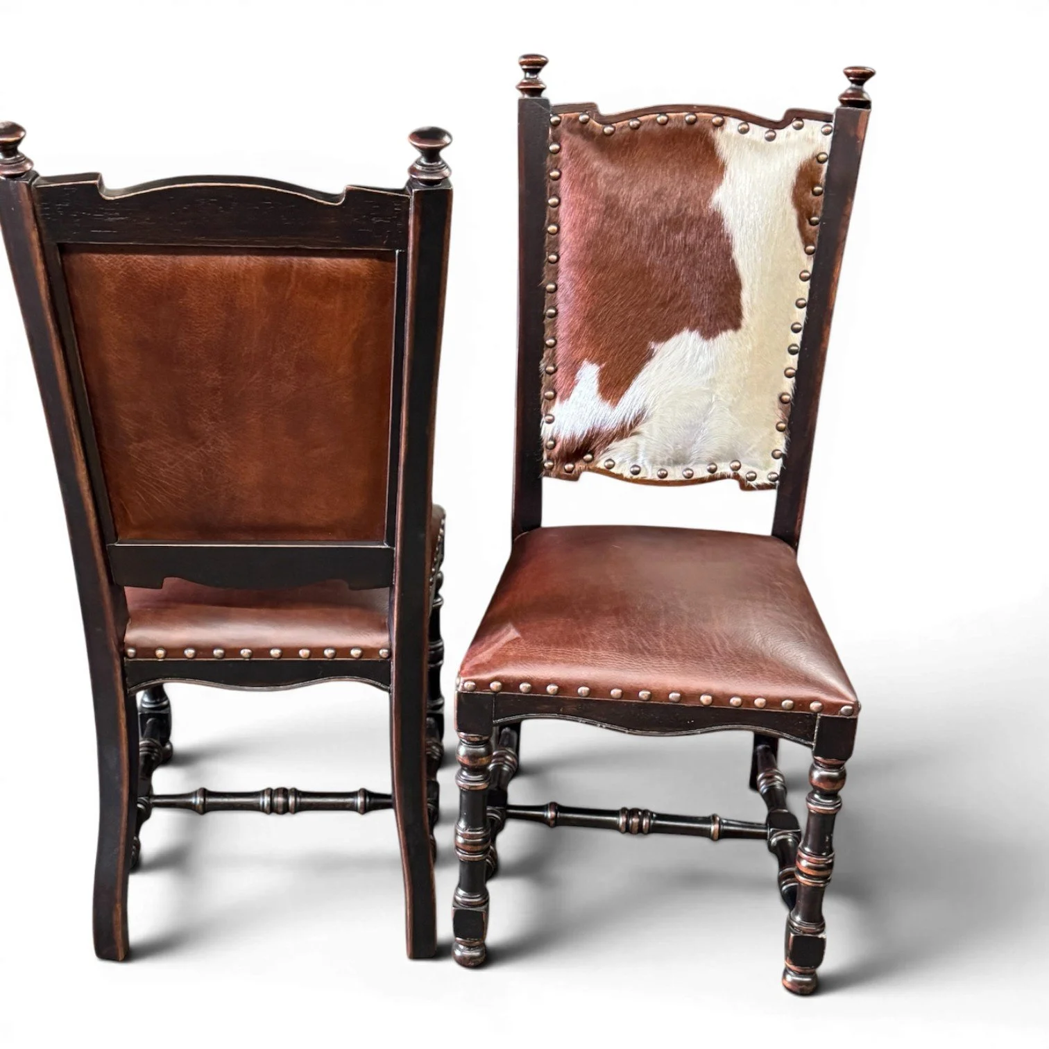 Handmade dining chair with cowhide back, leather seat, and carved wood frame