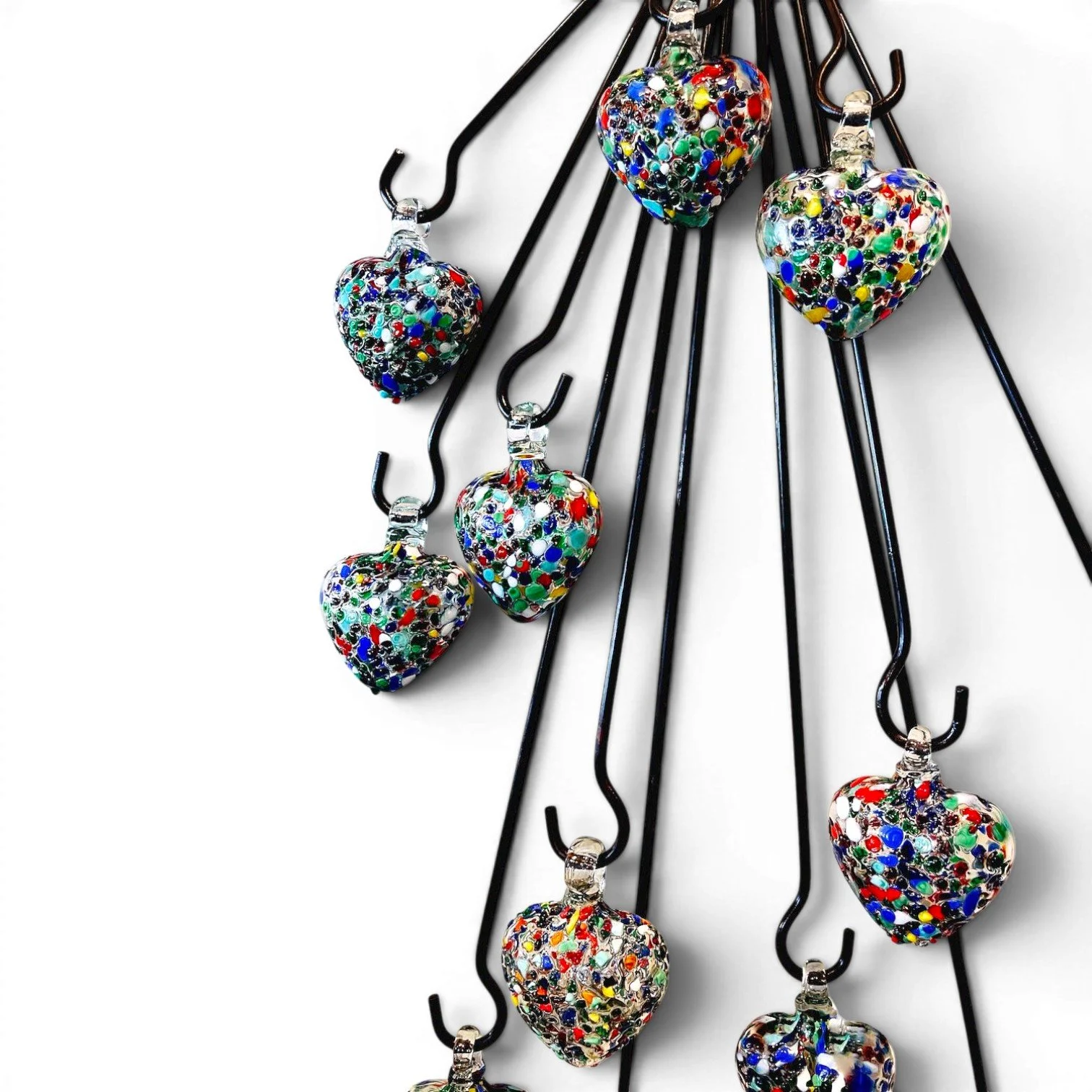Handmade Ristra Doce Corazones wall hanging from Mexico featuring 12 colorful handblown glass hearts on an iron ristra frame.