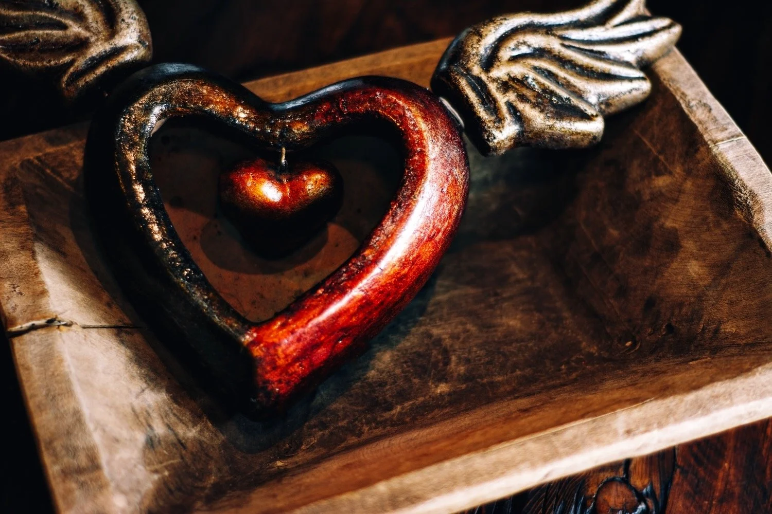 Clay sacred heart with wings in a rich golden red color. Handmade in Mexico. Visit Milagros Rústicos in Arizona today.