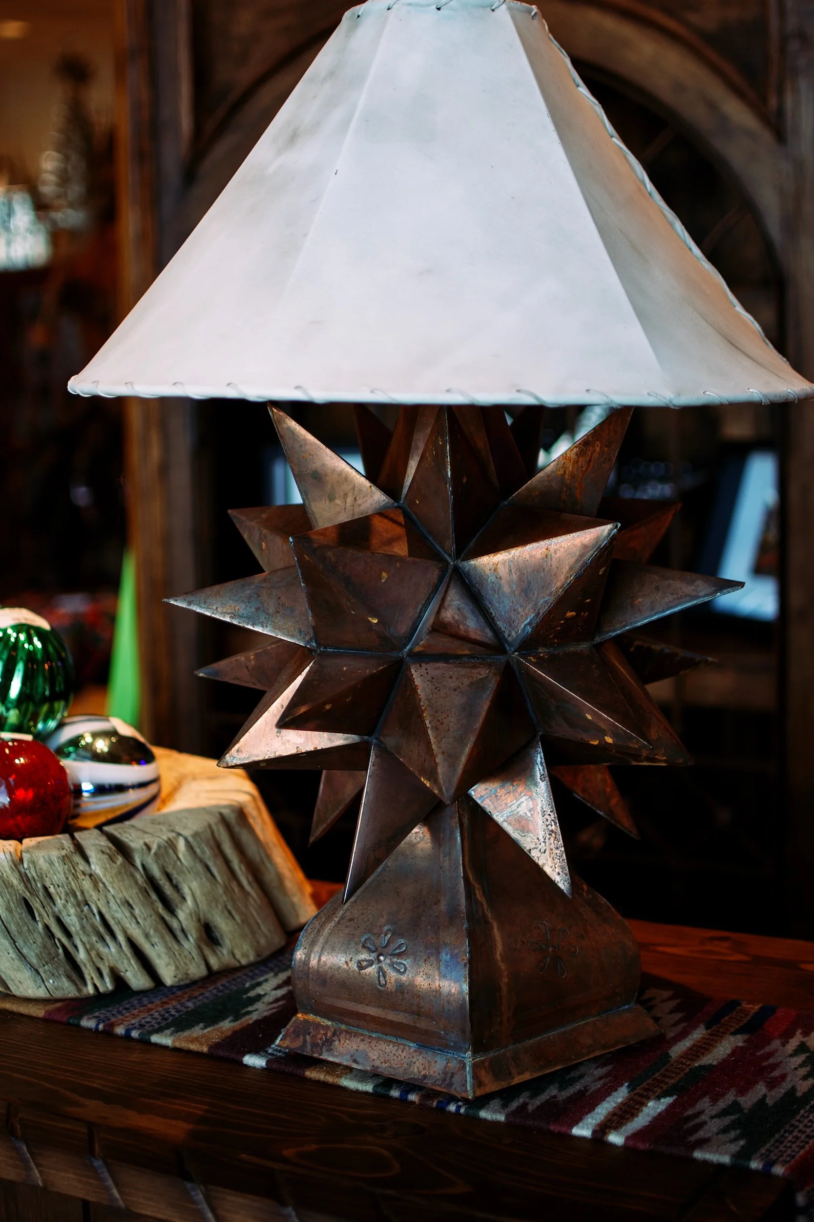 Estrella table lamp with white rawhide lampshade from Mexico.