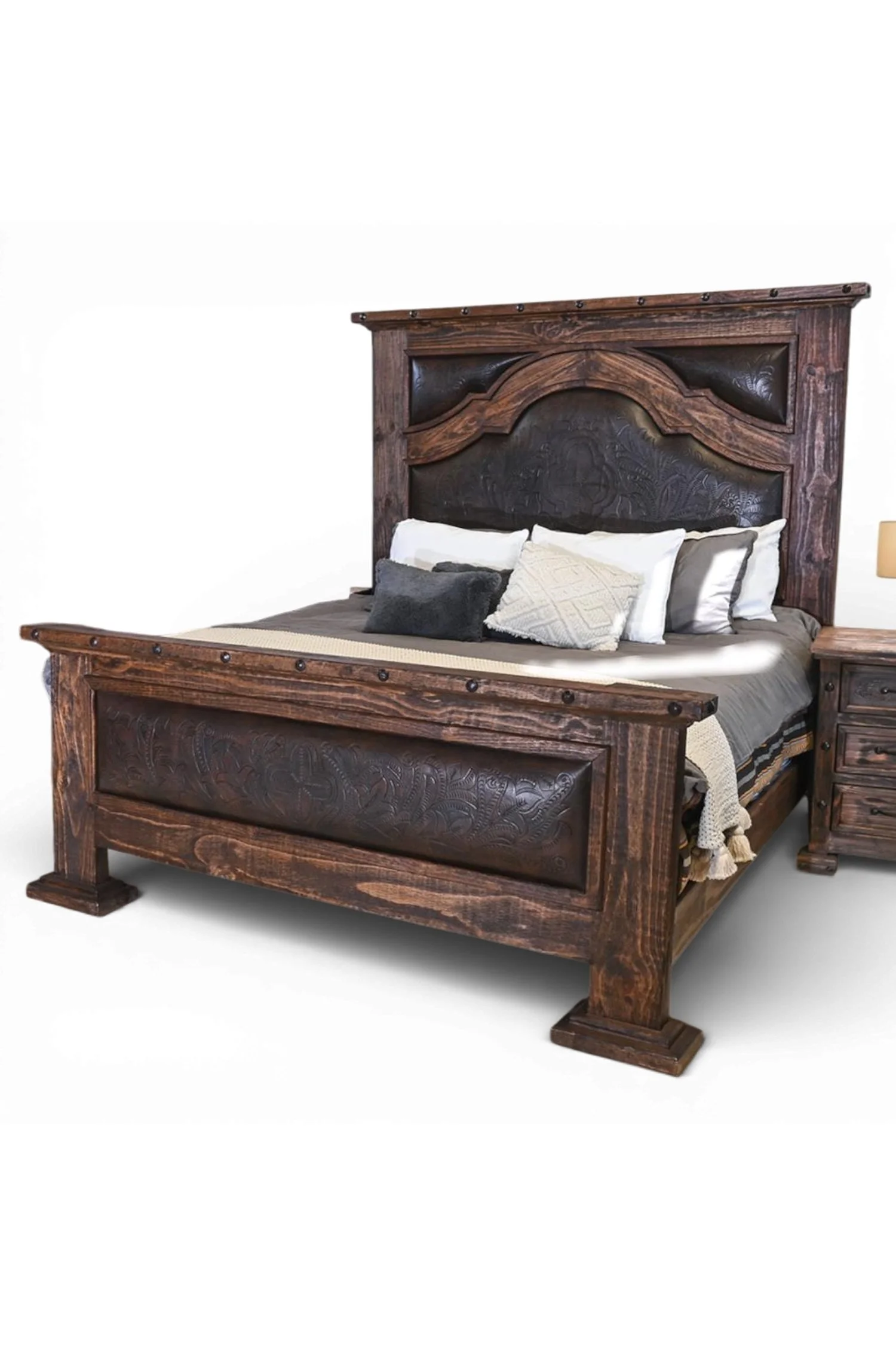 Shop a handmade tooled leather bed from Mexico. Rustic reclaimed wood frame with artisan craftsmanship for elegant hacienda-style bedrooms.