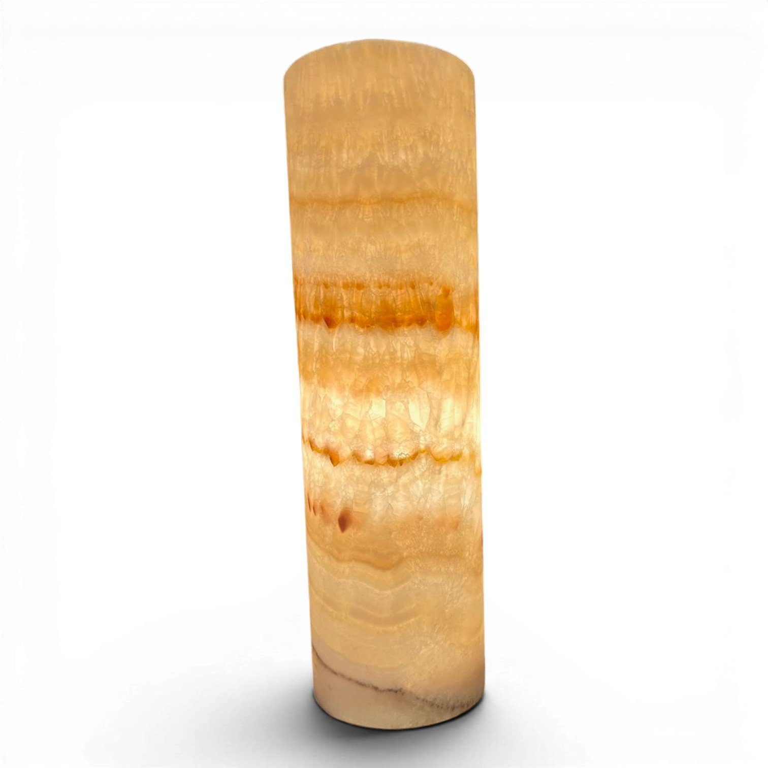 Handmade Mexican cylinder onyx lamp with warm glowing natural stone and coastal luxury design